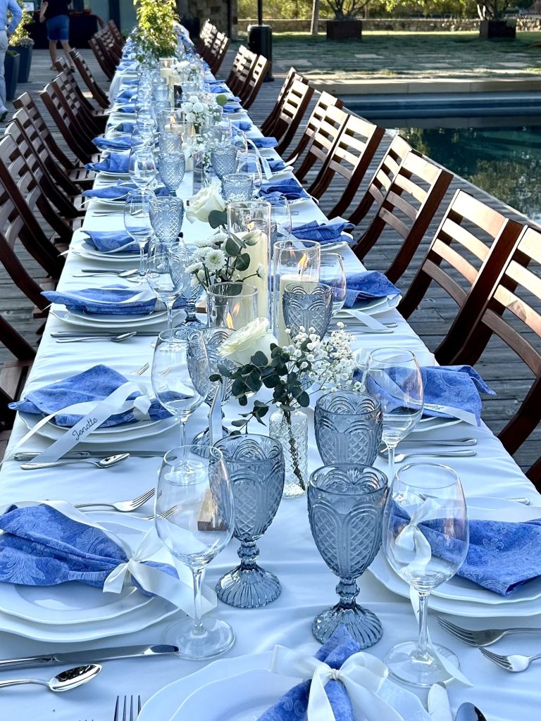 An intimate poolside dinner at dusk beside the Vineyard House