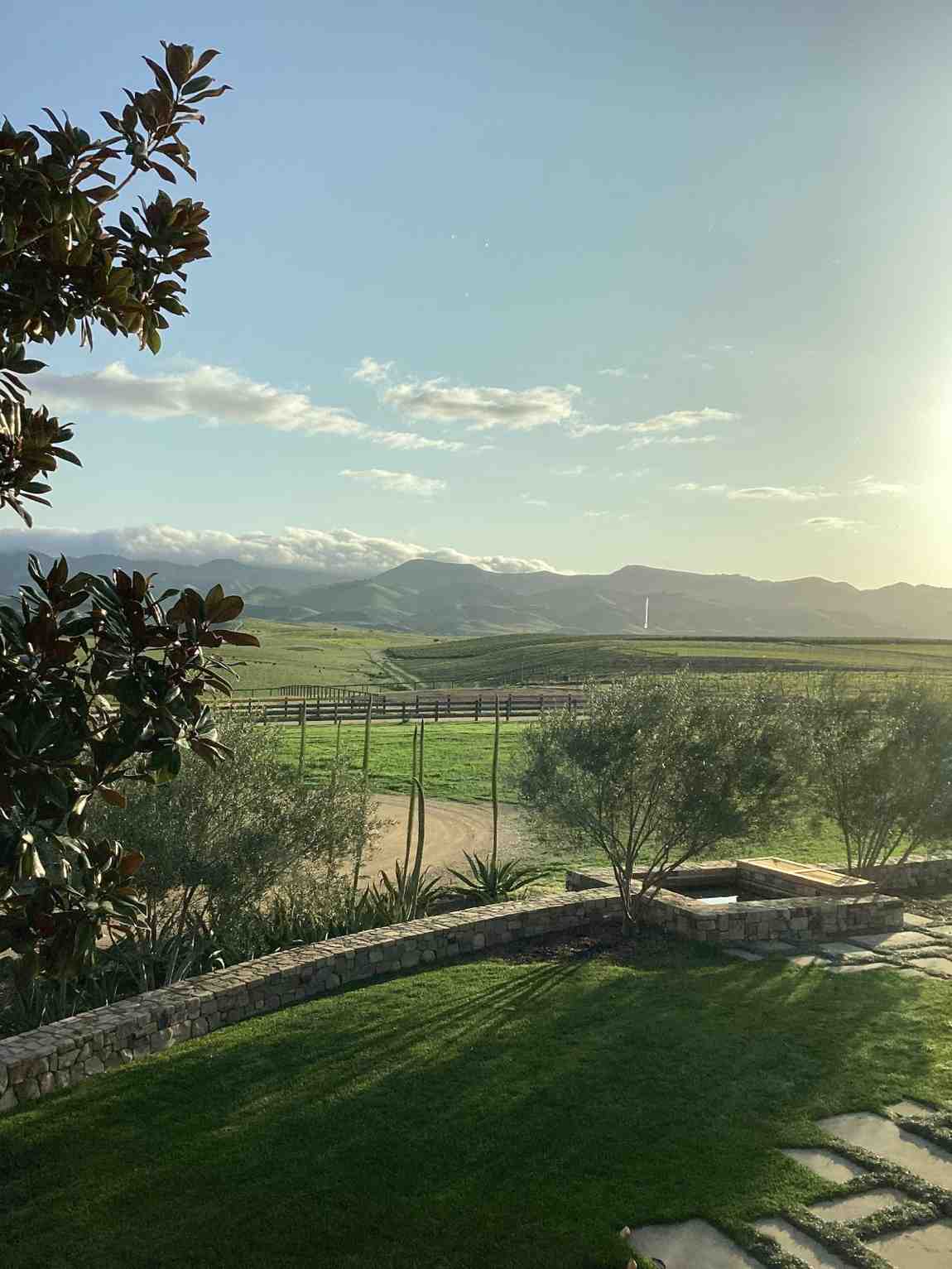 Rolling green vineyard hills and mountains viewed from the Vineyard House at sunrise