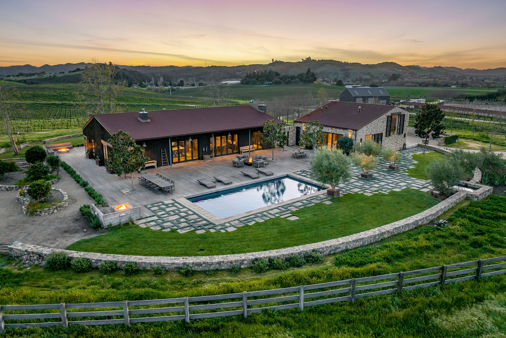 Vineyard House exterior, view 2 of the grounds, pool, decks, and vineyards