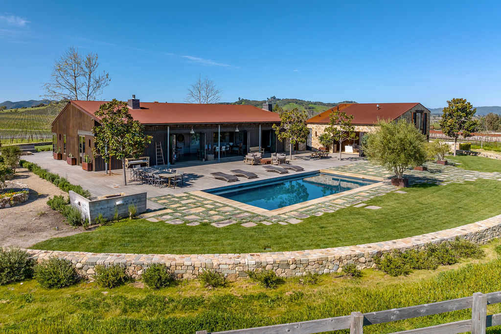 Vineyard House exterior, view 4 of the grounds, pool, decks, and vineyards