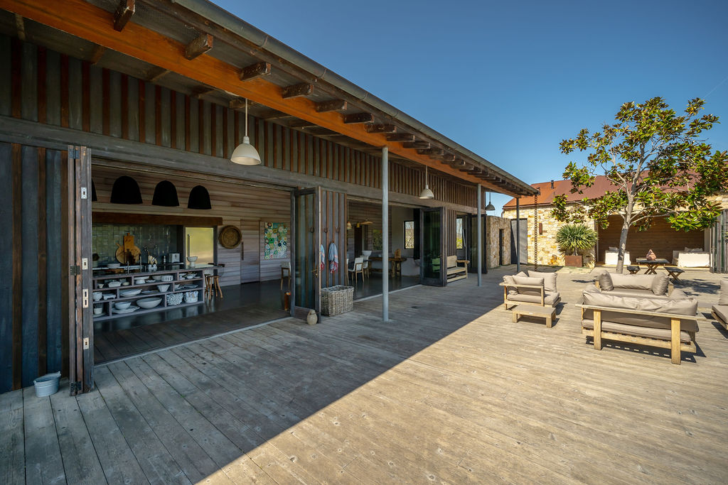 Vineyard House exterior, view 6 of the grounds, pool, decks, and vineyards