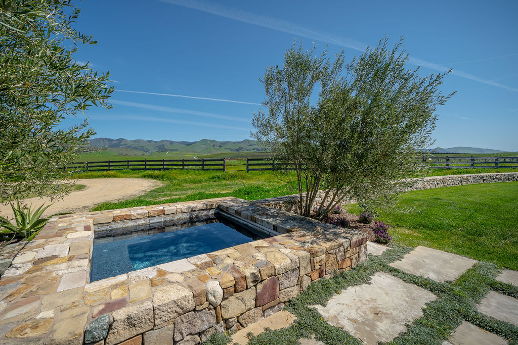 Vineyard House exterior, view 10 of the grounds, pool, decks, and vineyards