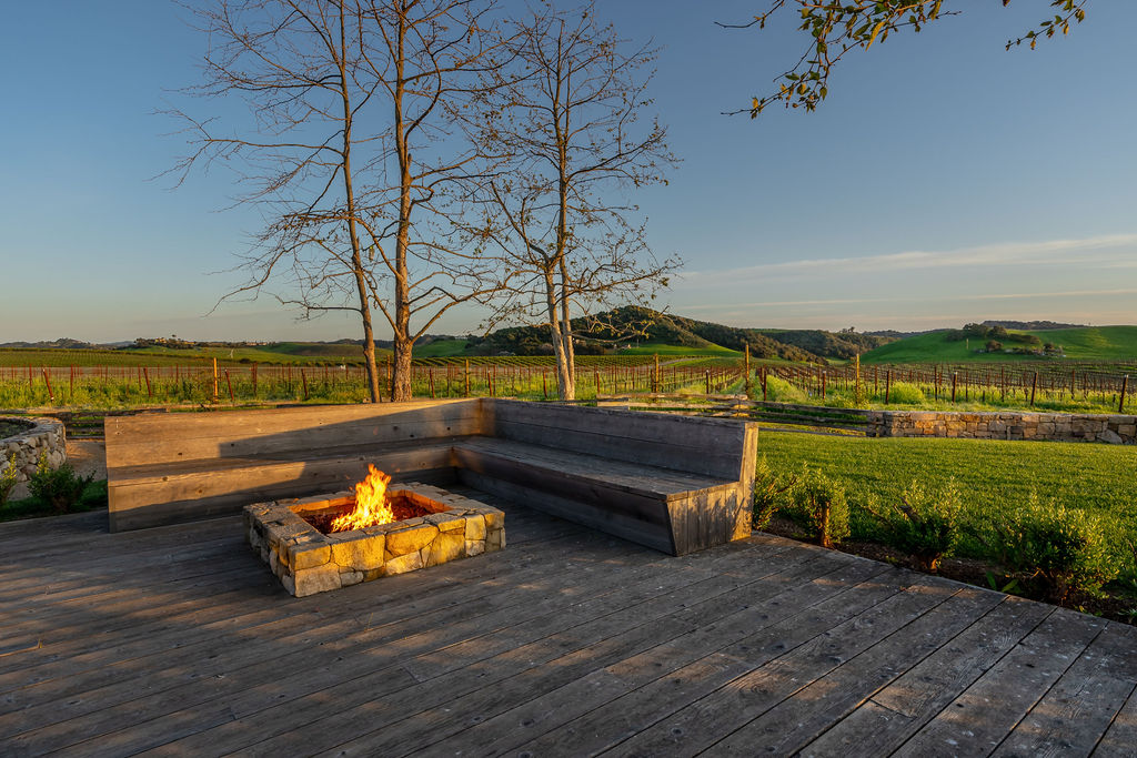 Vineyard House exterior, view 11 of the grounds, pool, decks, and vineyards