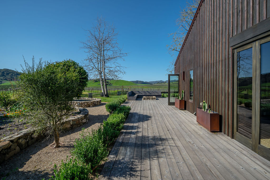 Vineyard House exterior, view 13 of the grounds, pool, decks, and vineyards