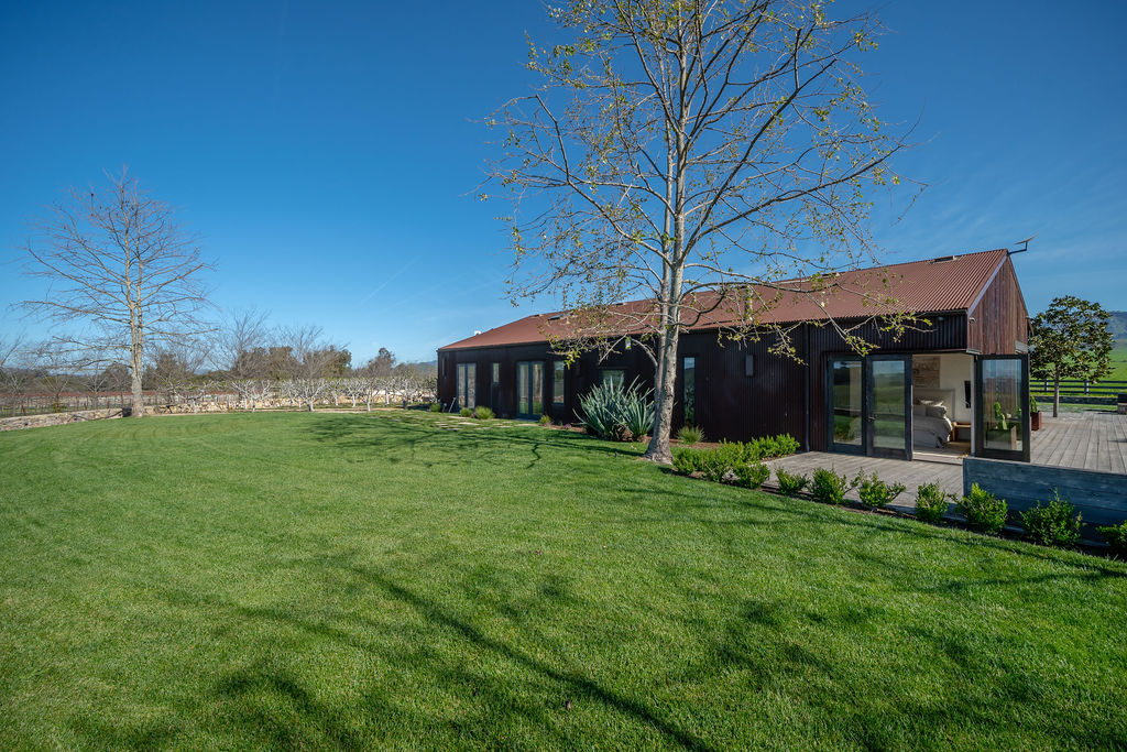 Vineyard House exterior, view 15 of the grounds, pool, decks, and vineyards