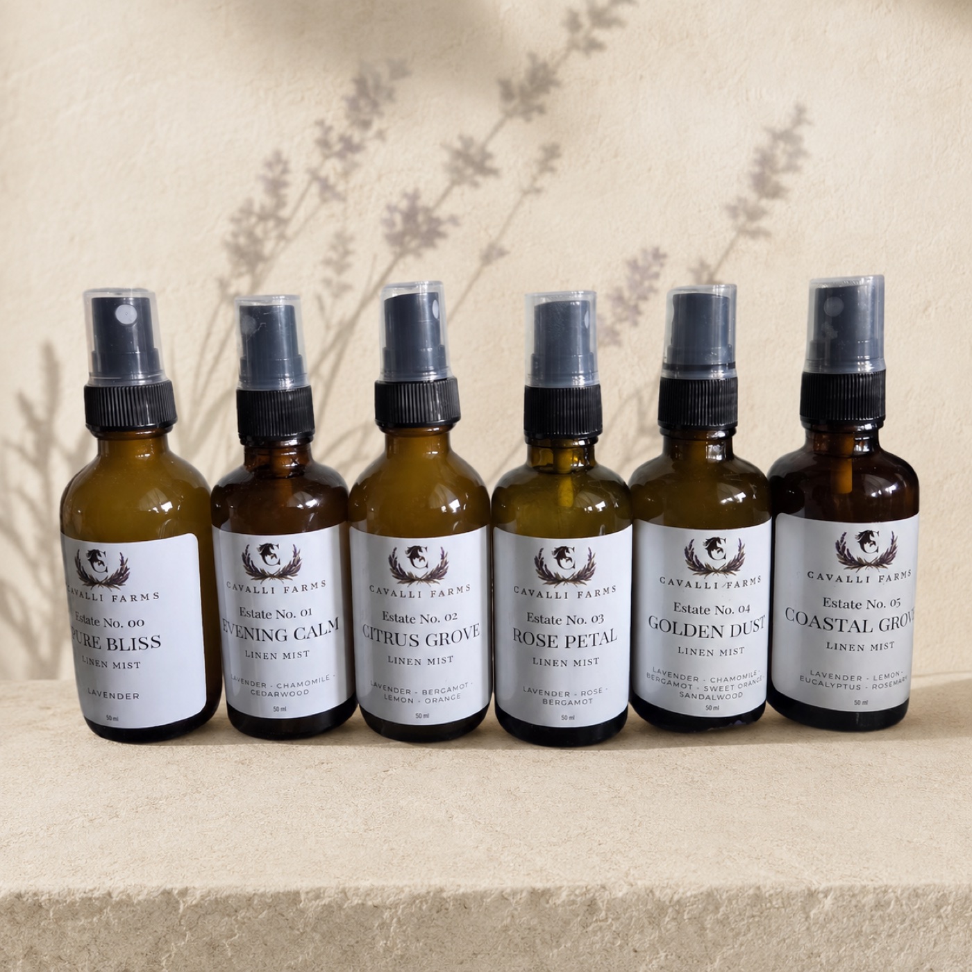 Six amber bottles of Cavalli Farms Estate No. linen mists